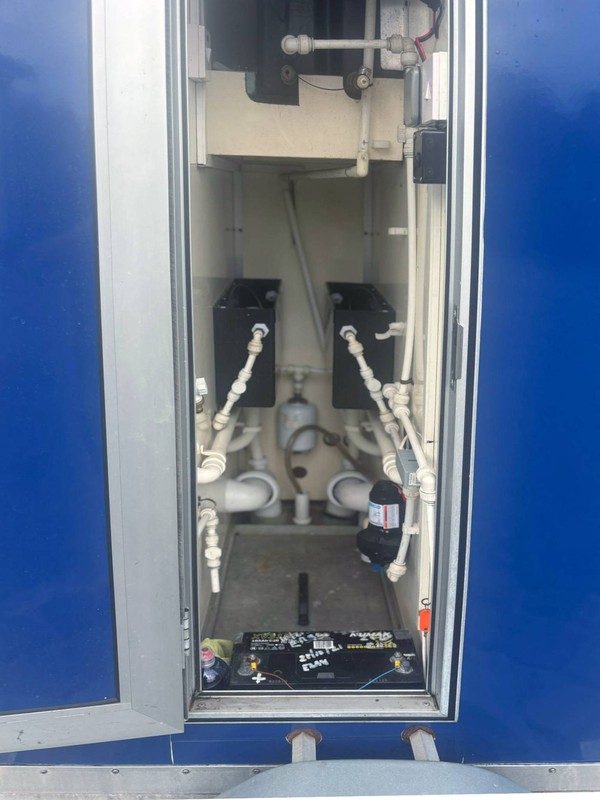 Toilet trailer service cupboard