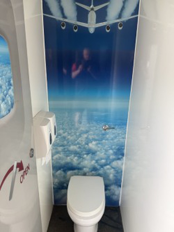 Flying themed toilet trailer