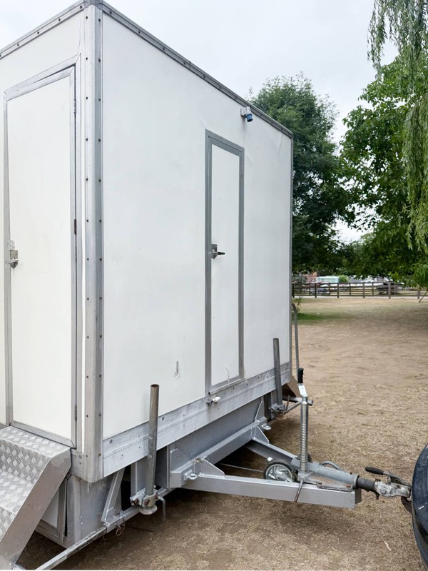 Toilet trailer service door