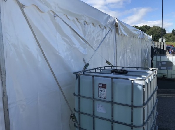 IBC used as weights for a marquee