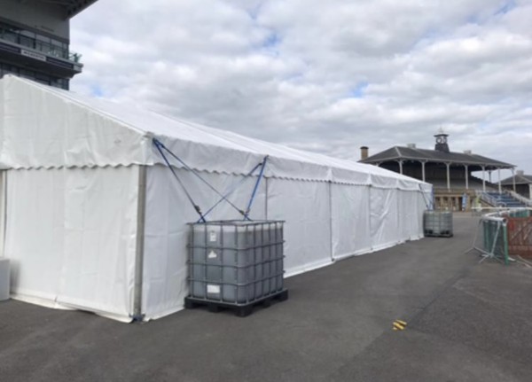 Water ballast used to hold down a marquee