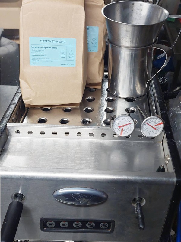 Espresso machine with coffee
