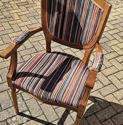 Arm chairs with a striped fabric.