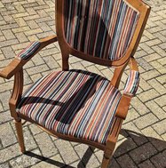 Arm chairs with a striped fabric.