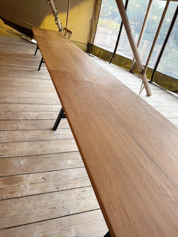 Very long oak trestle tables