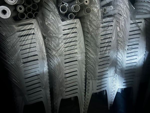 Stacking white patio chairs