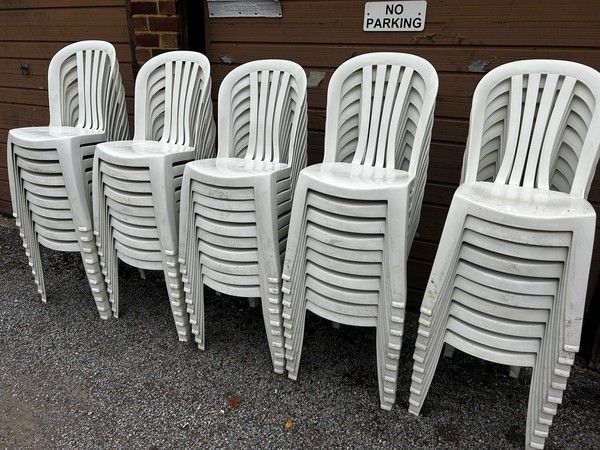 White stacking bistro chairs