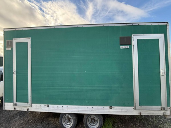 Twin wheel green toilet trailer