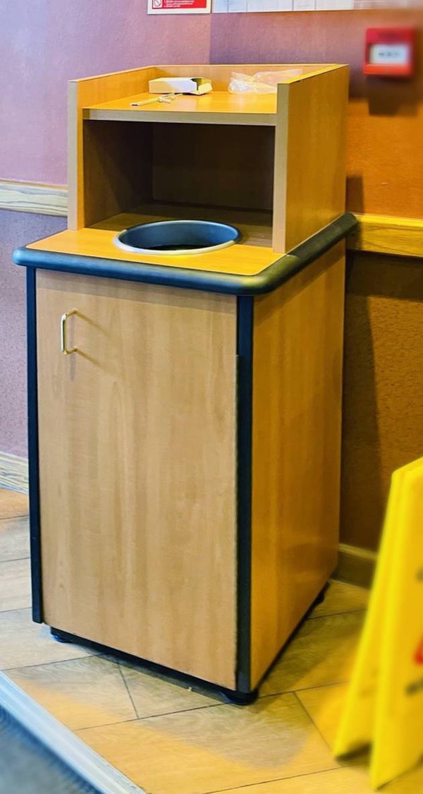 Waste bin cupboard with drop hole Waste bin cupboard with drop hole