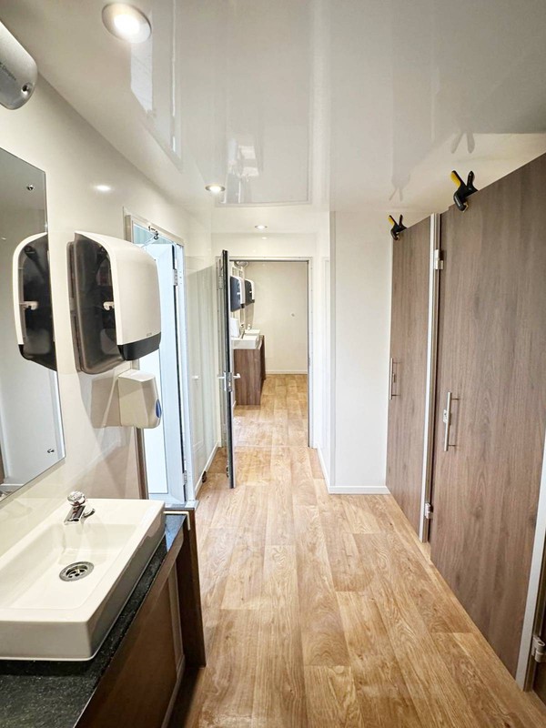 Ladies and gents toilet trailer with adjoining door