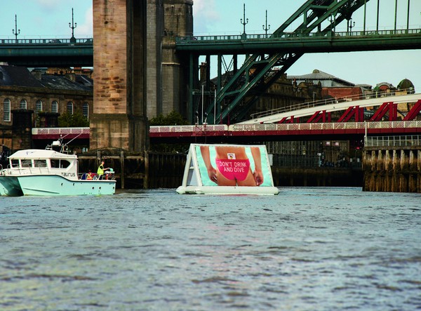 Floating banner towable