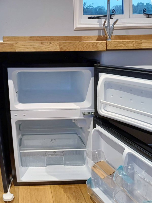 Shepherds hut kitchen with fridge
