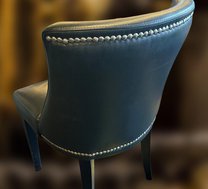 Used chairs with stud detail on a curved back Used chairs with stud detail on a curved back