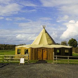 Tipi with wooden sides