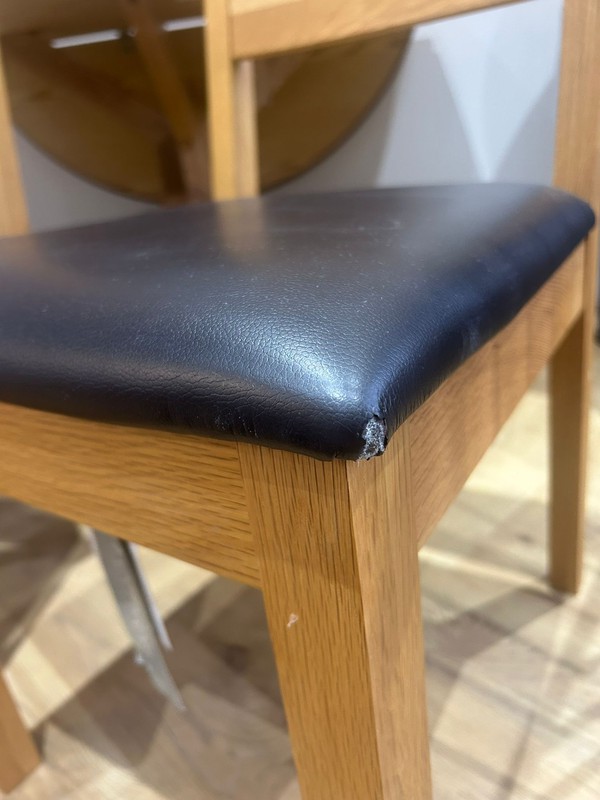 Oak chairs with black seat pads