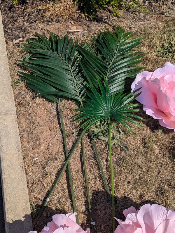 Pink faux flowers with leaves