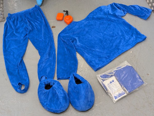 Costume with ice pack cooling vest and head cooling fan