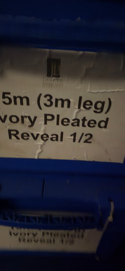 Ivory pleated reveal curtain