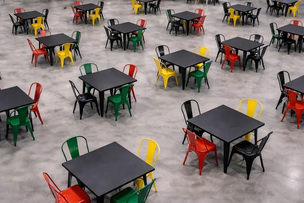 Black steel tables with colourful tolix chairs Black steel tables with colourful tolix chairs