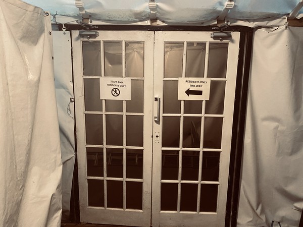 Self closing marquee doors