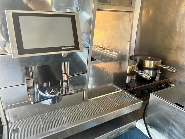 Black and white coffee machine