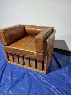 Reclaimed wood pallet chairs with leather cushions