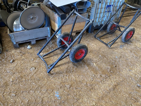 Rolls of carpet transport trollies