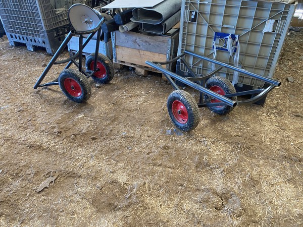 Trolley for moving rolls of carpet