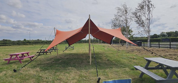 Used orange stretch tent