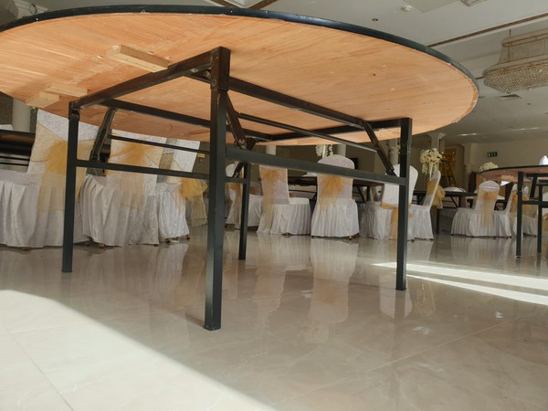 Banqueting table with folding legs