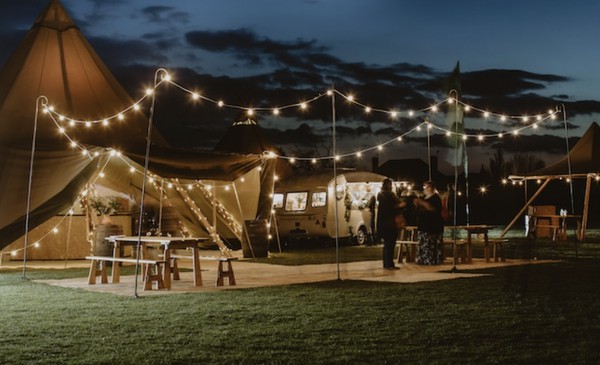 Festoon lighting held up with shepherd's crooks Festoon lighting held up with shepherd's crooks