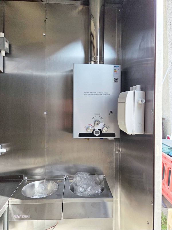 Catering trailer with instant hot water