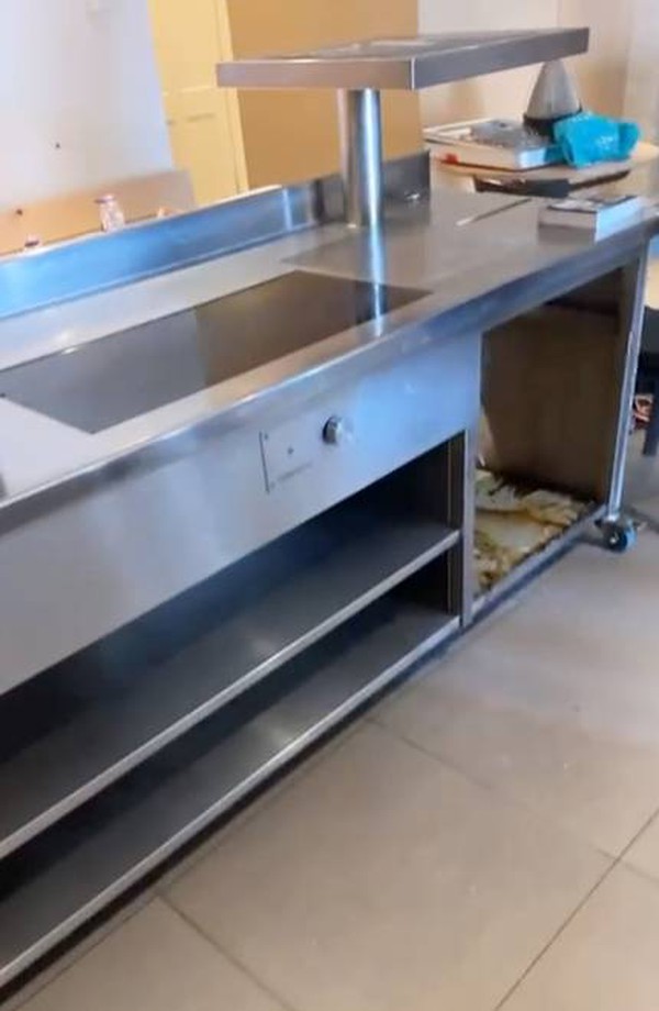 Stainless steel prep counter with induction hobs Stainless steel prep counter with induction hobs