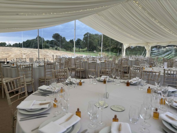 Framed marquee with ivory lining and clear gables