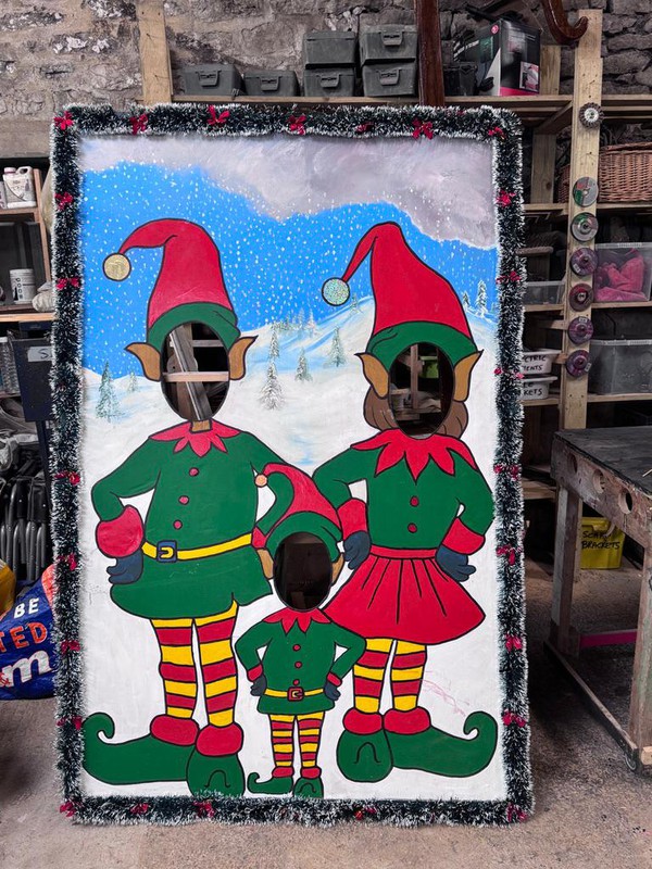 Christmas elves peep through boards Christmas elves peep through boards