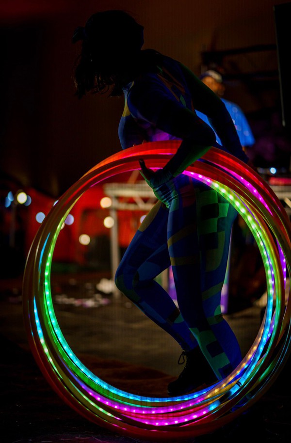 Festival performer with hoops at night Festival performer with hoops at night