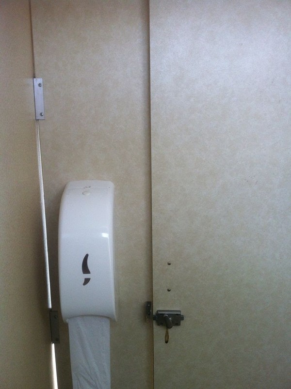 Toilet roll dispenser and locking doors