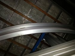 Curved marquee roof beams