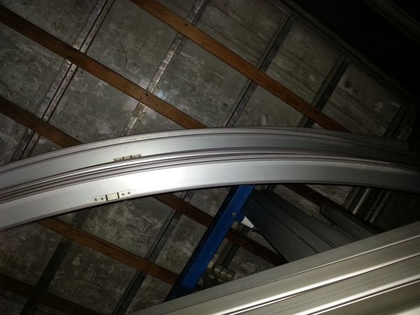Curved marquee roof beams