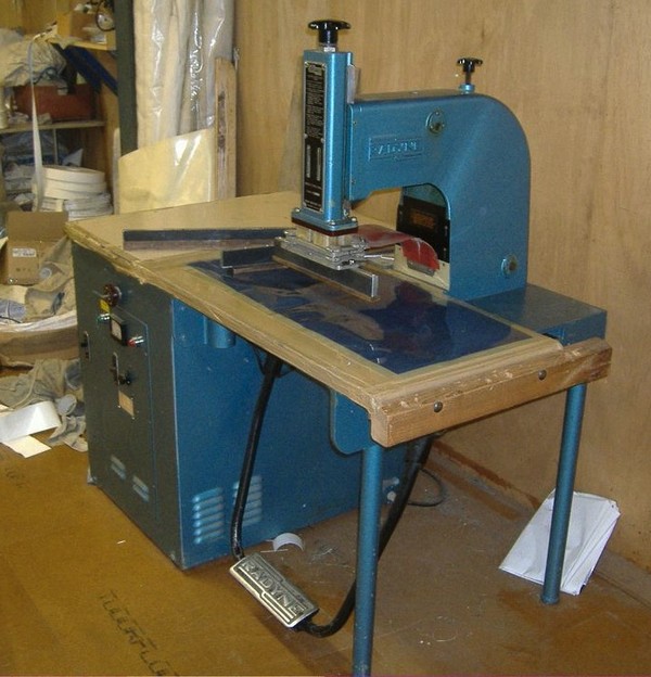 Foot press welder with tools.