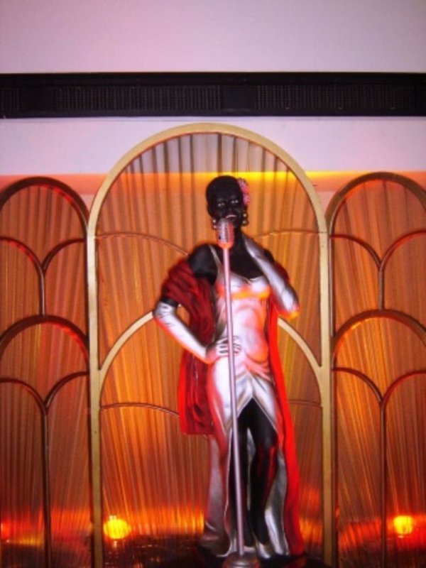 Rosie the jazz singer with her art deco backdrop