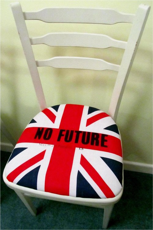 Upcycled white chairs with Sex Pistols Punk Rock Seat Pads Upcycled white chairs with Sex Pistols Punk Rock Seat Pads