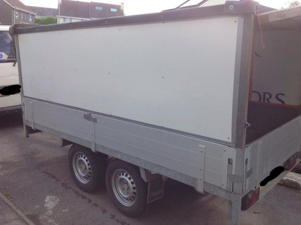 Drop side trailer with box