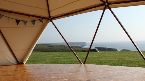 Geodesic dome with wooden frame and canvas covers