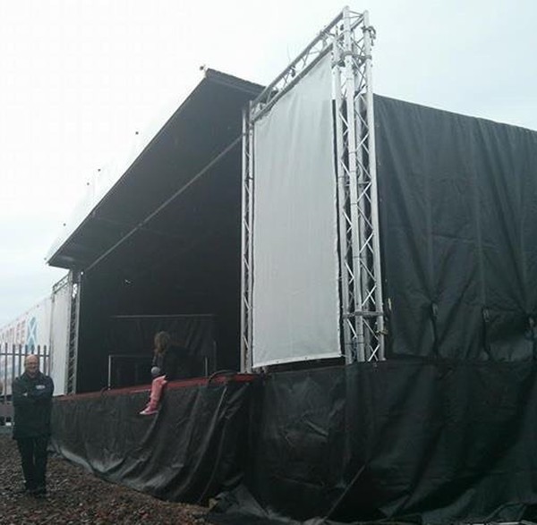Large mobile stage with wings.