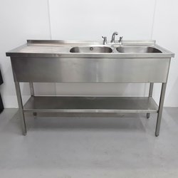 Stainless steel double sink on a stand.