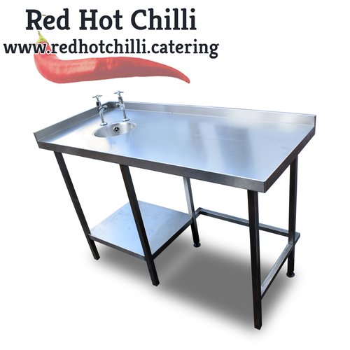 Stainless steel table with a small sink