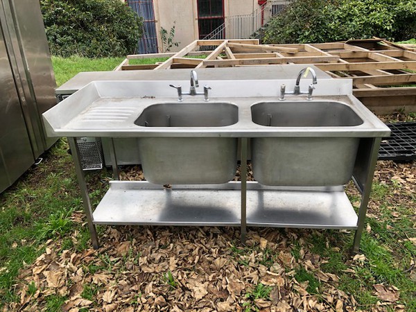 Stainless steel double sink with left hand drainer