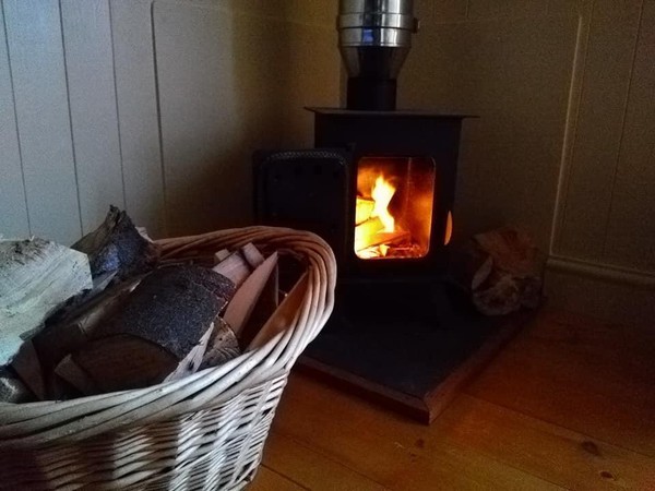 Wood stove in glamping hut