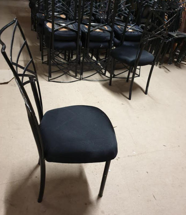 Used black ornate chairs